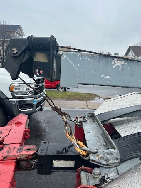 a 1989 Ford F-450 with a crane attached to it