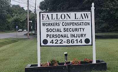 Fallon Law roadside sign for workers’ compensation, social security, and personal injury services