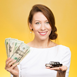 Woman holding cash and model black car