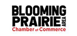 Blooming Prairie Area Chamber of Commerce logo in black and red text.