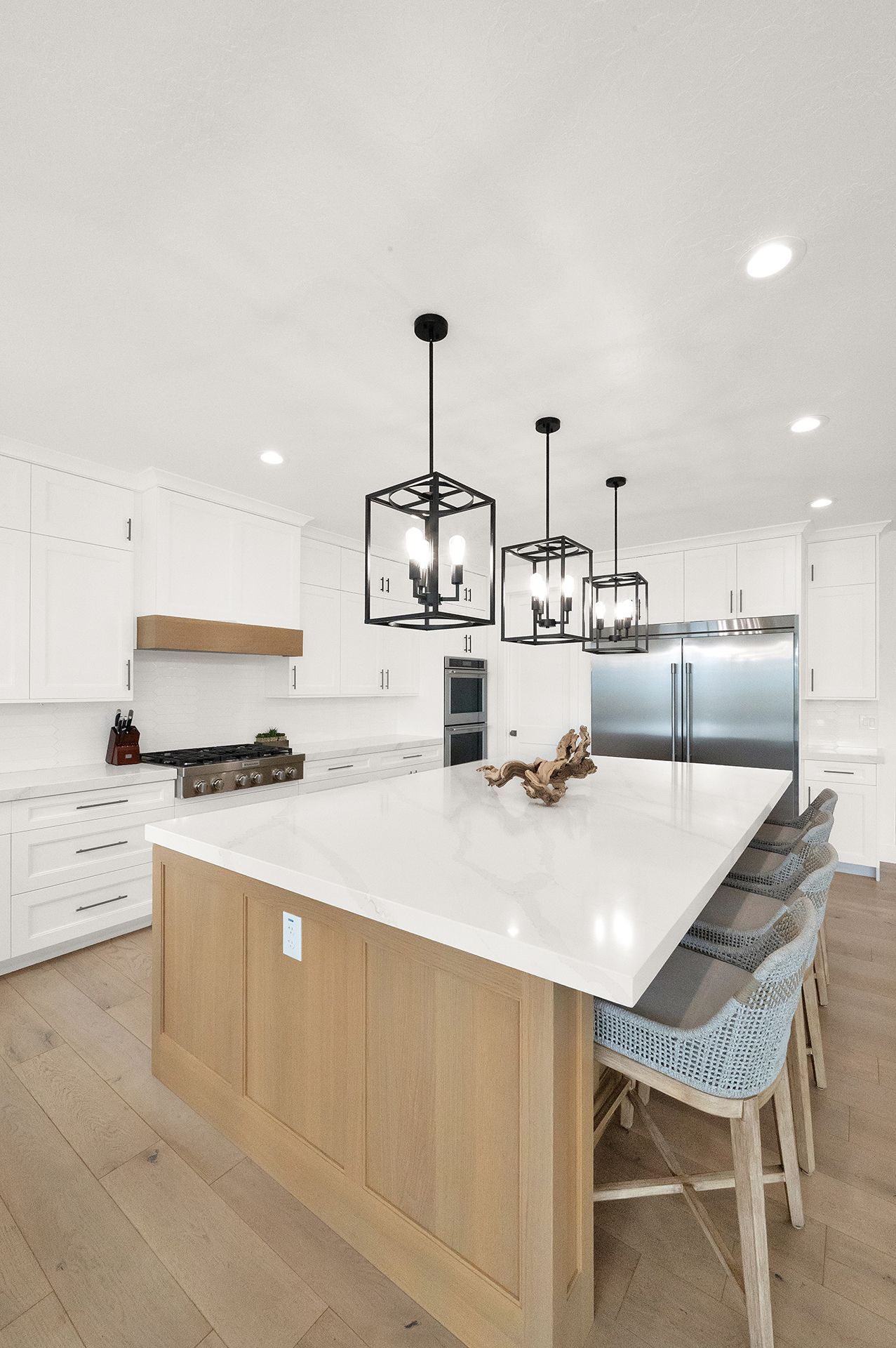There is a large island in the middle of the kitchen.