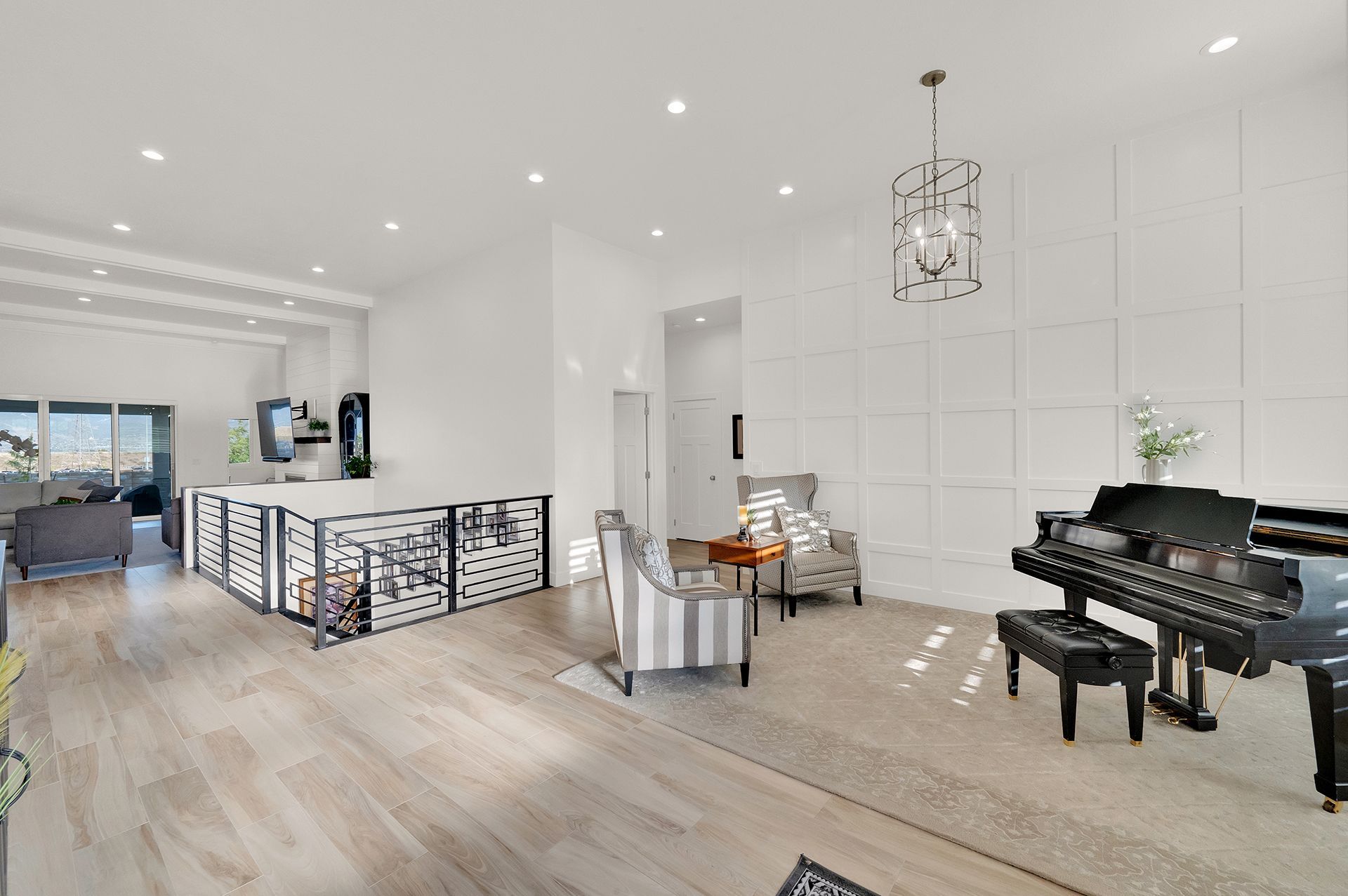 There is a piano in the middle of the living room.