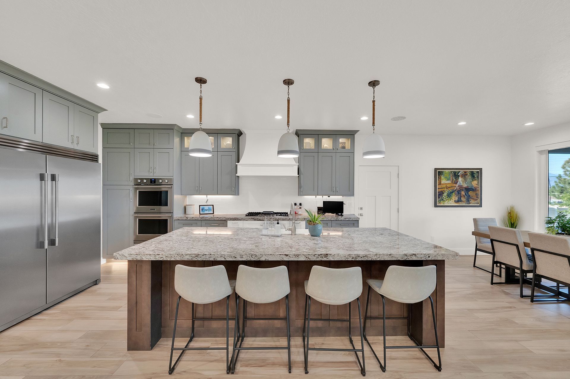 A kitchen with a large island and stools