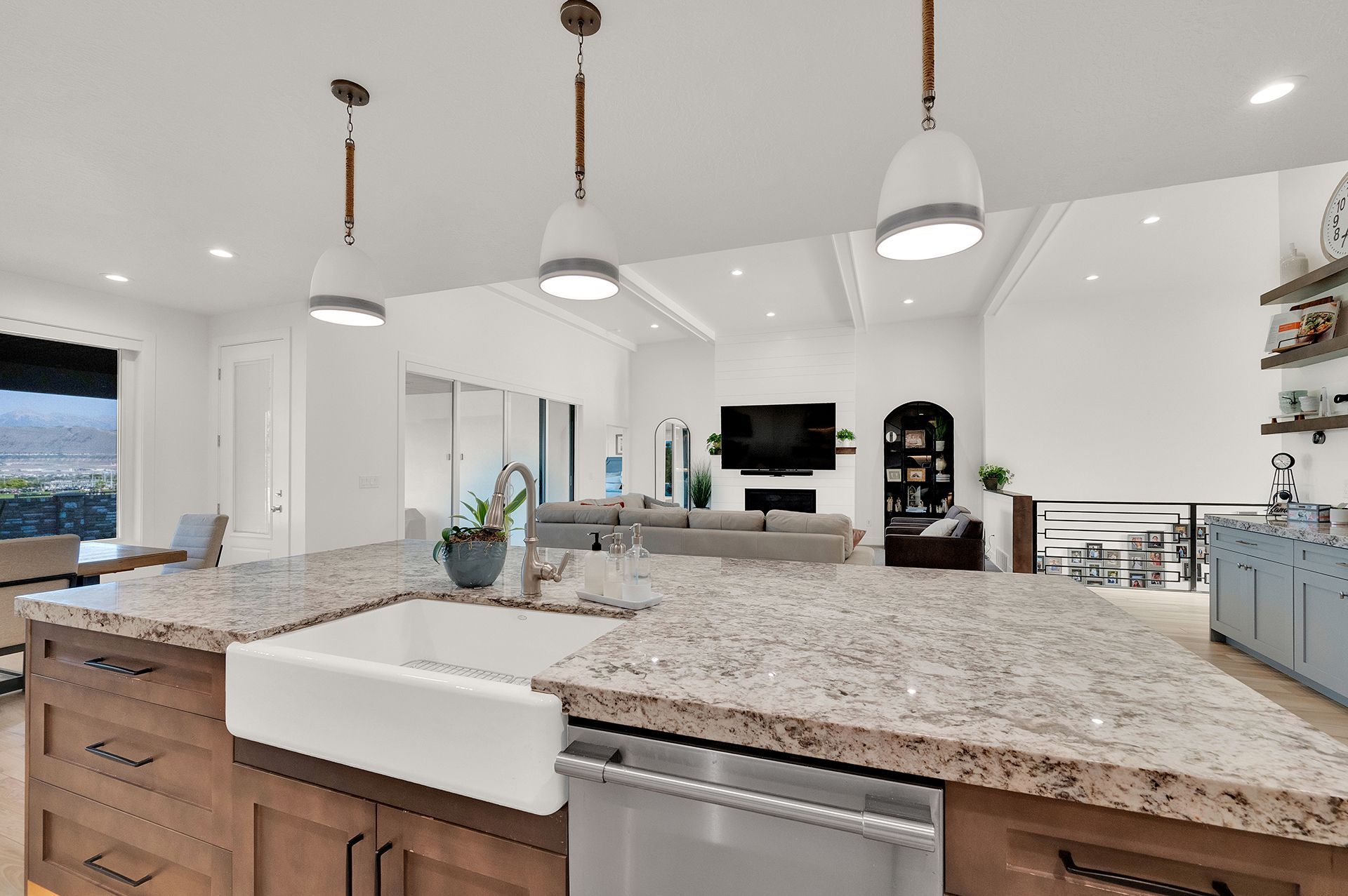 A kitchen with granite counter tops and stainless steel appliances
