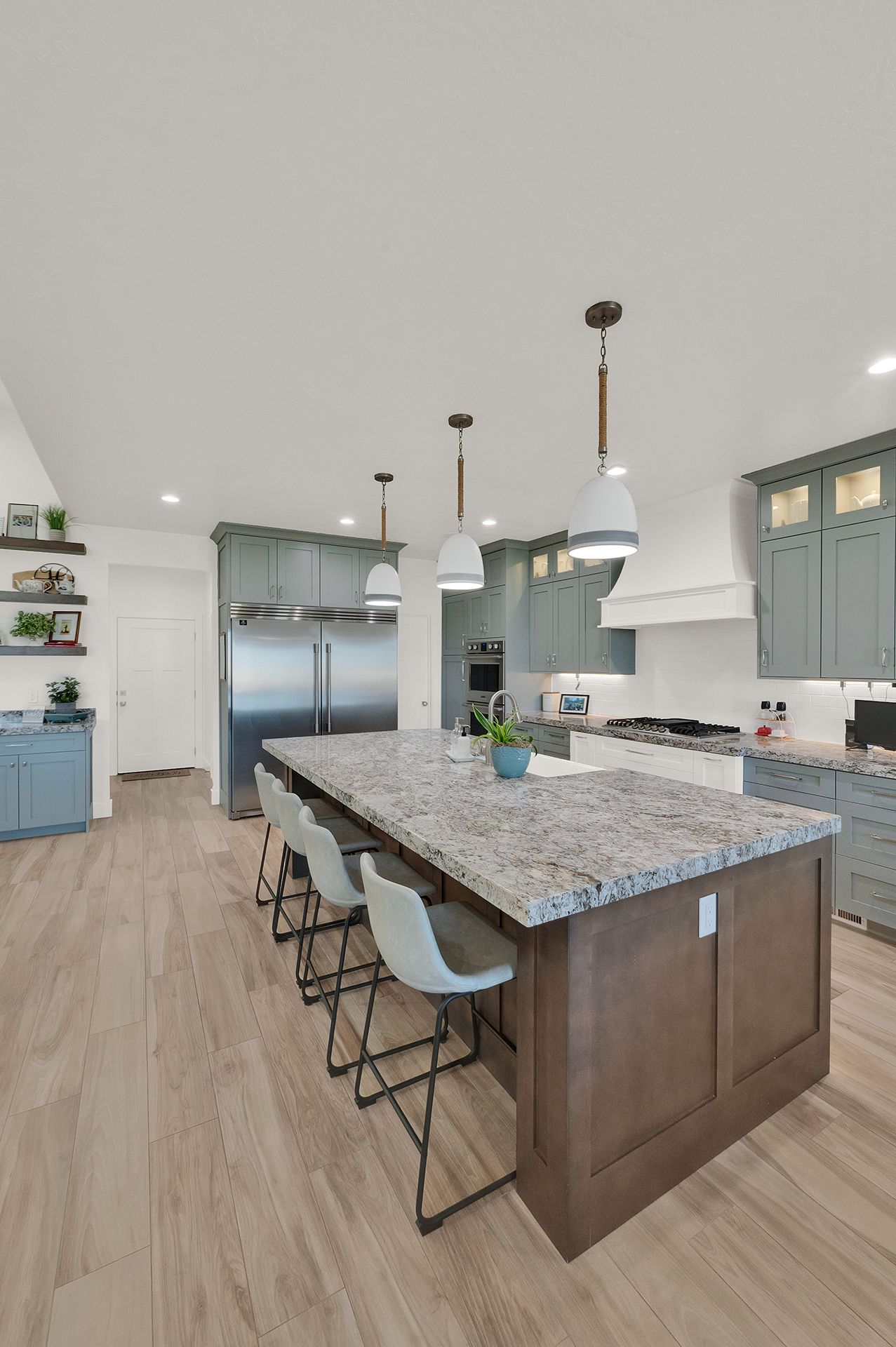 There is a large island in the middle of the kitchen.