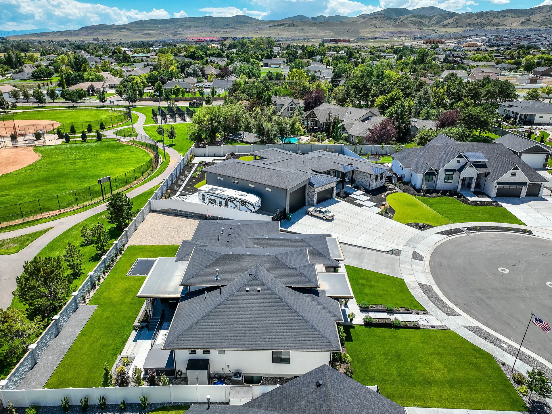 An aerial view of a large house in a residential area