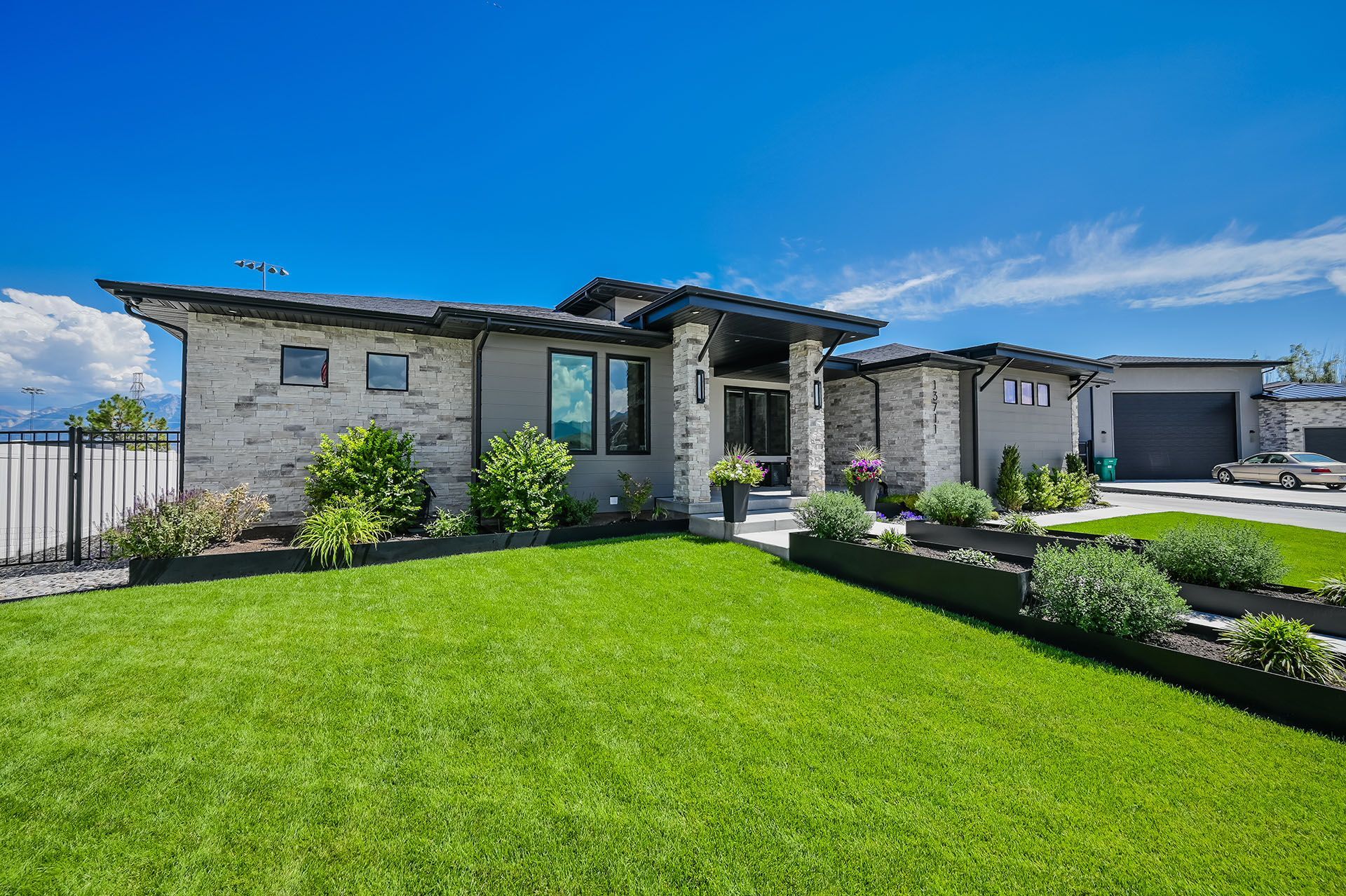 A large house with a lush green lawn in front of it.