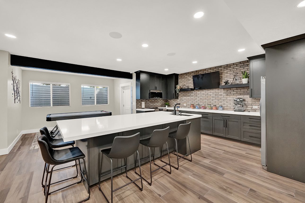 There is a large island in the middle of the kitchen.