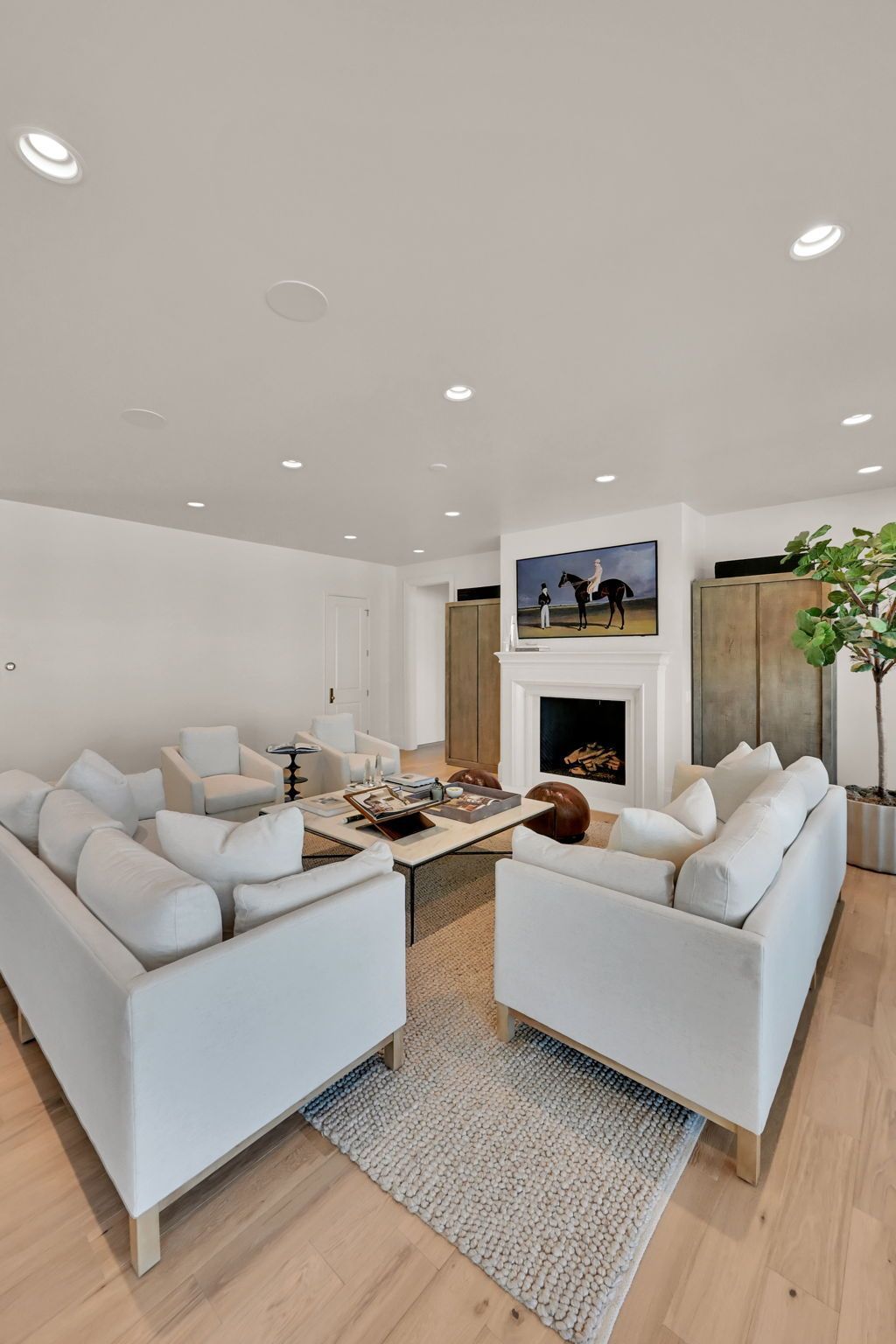 A living room filled with furniture and a fireplace.