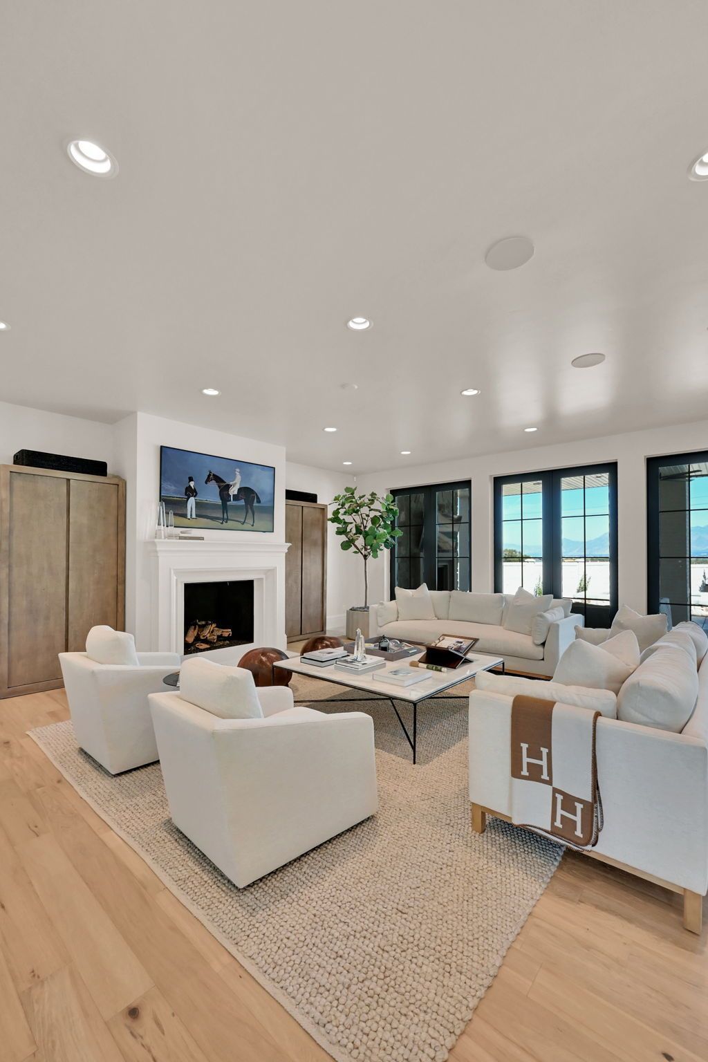A living room filled with furniture and a fireplace.