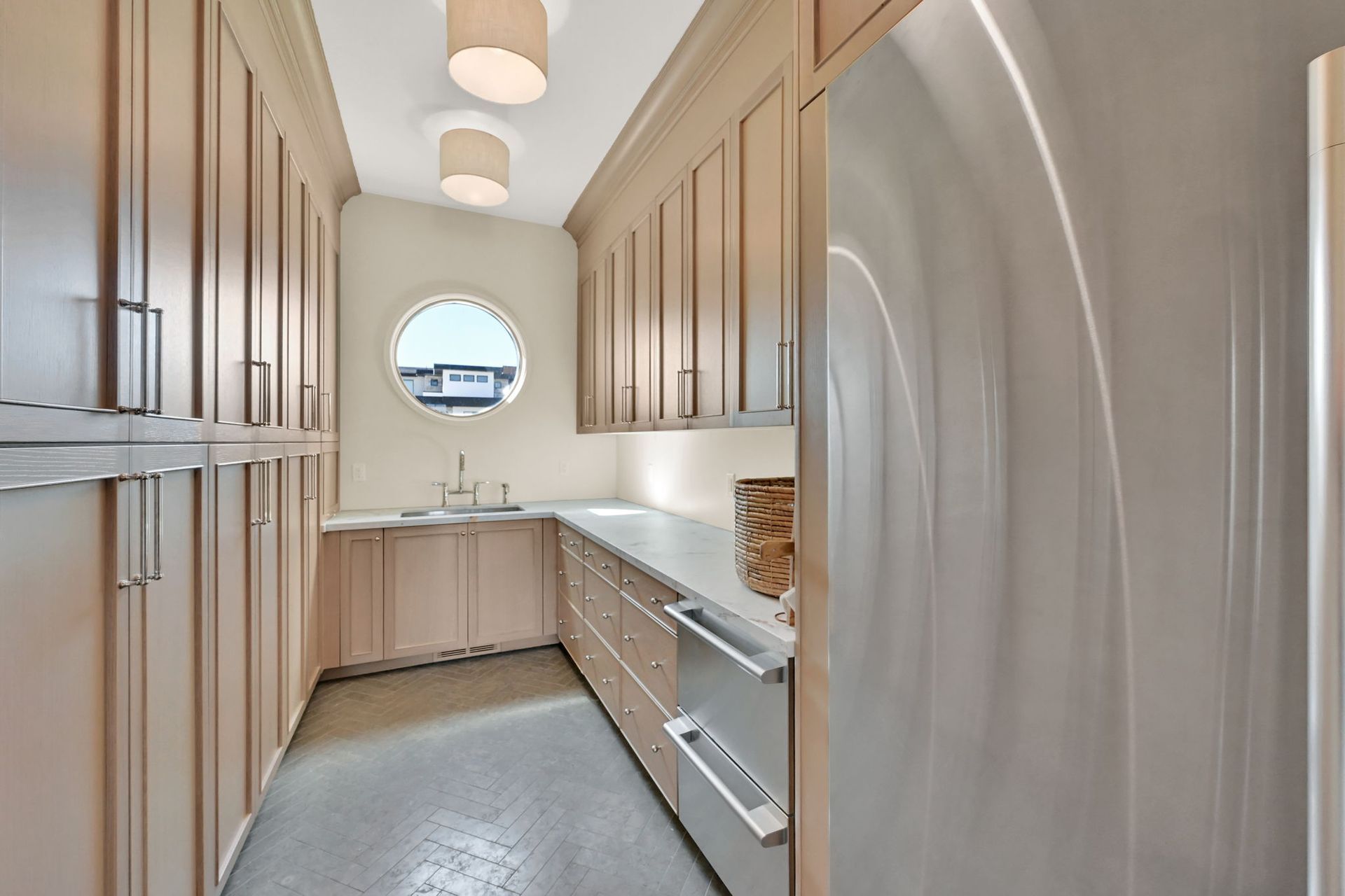A kitchen with stainless steel appliances and wooden cabinets