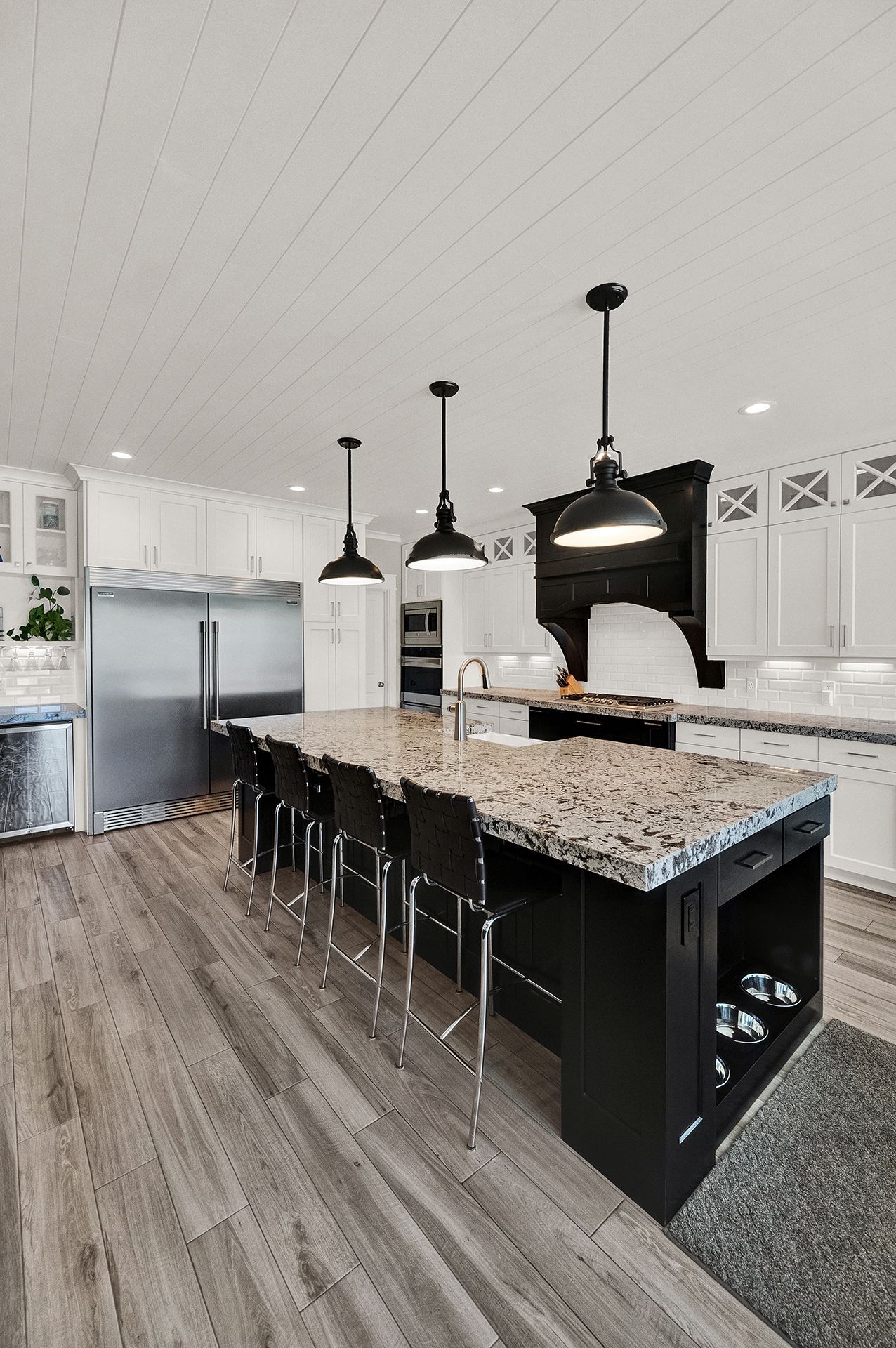 There is a large island in the middle of the kitchen.