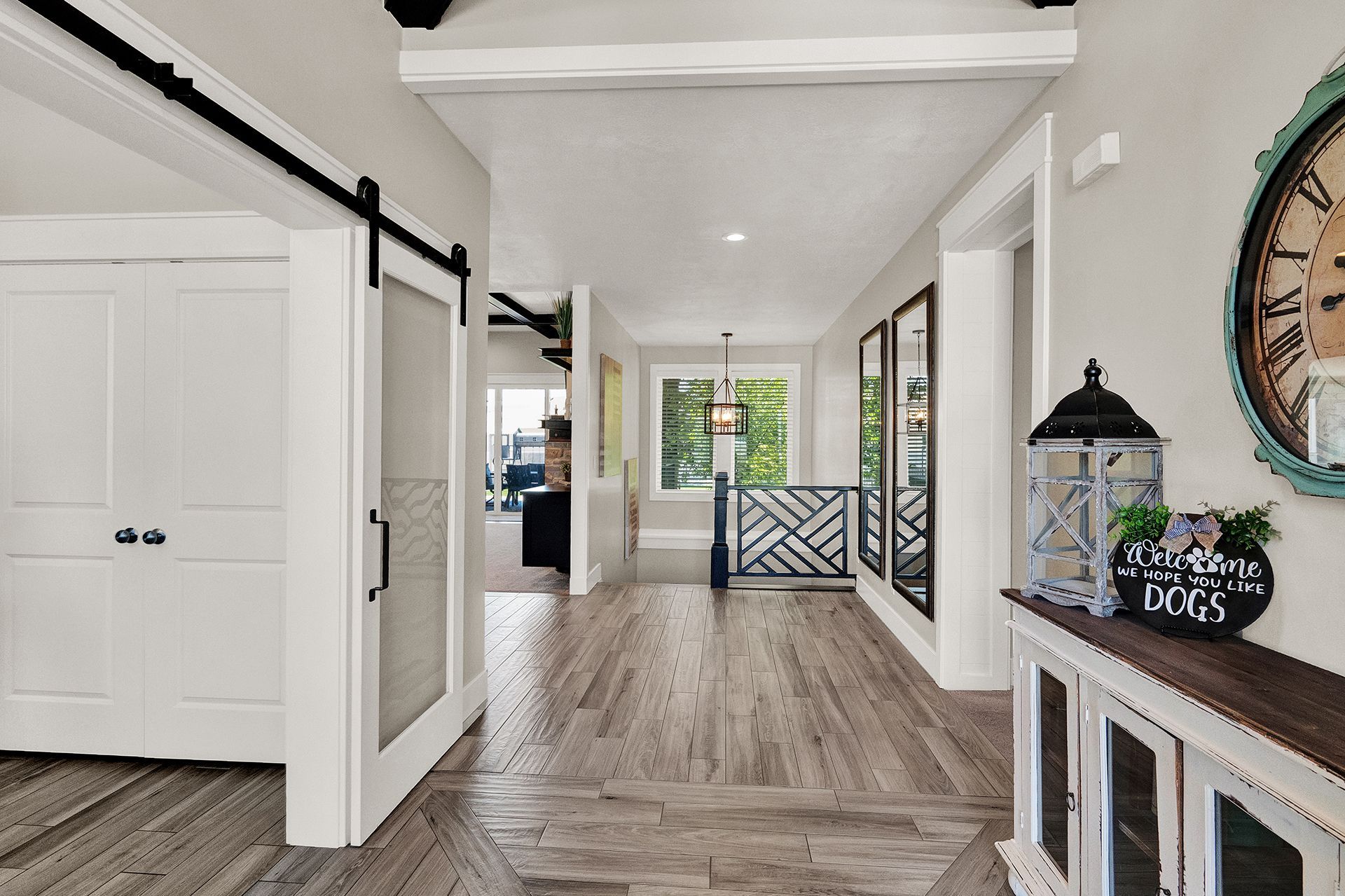 A hallway in a house with a clock on the wall
