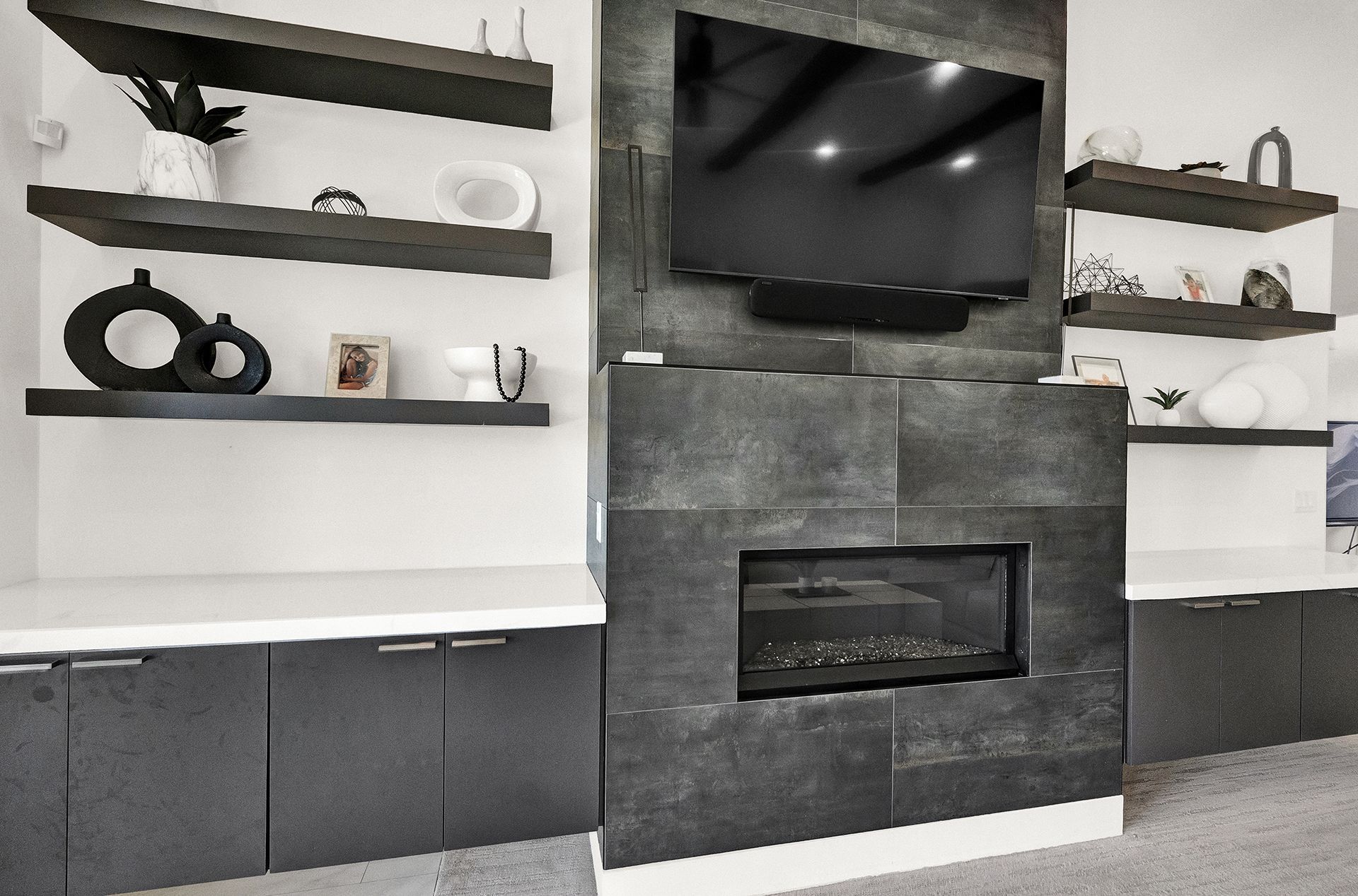 A living room with a fireplace and a flat screen tv