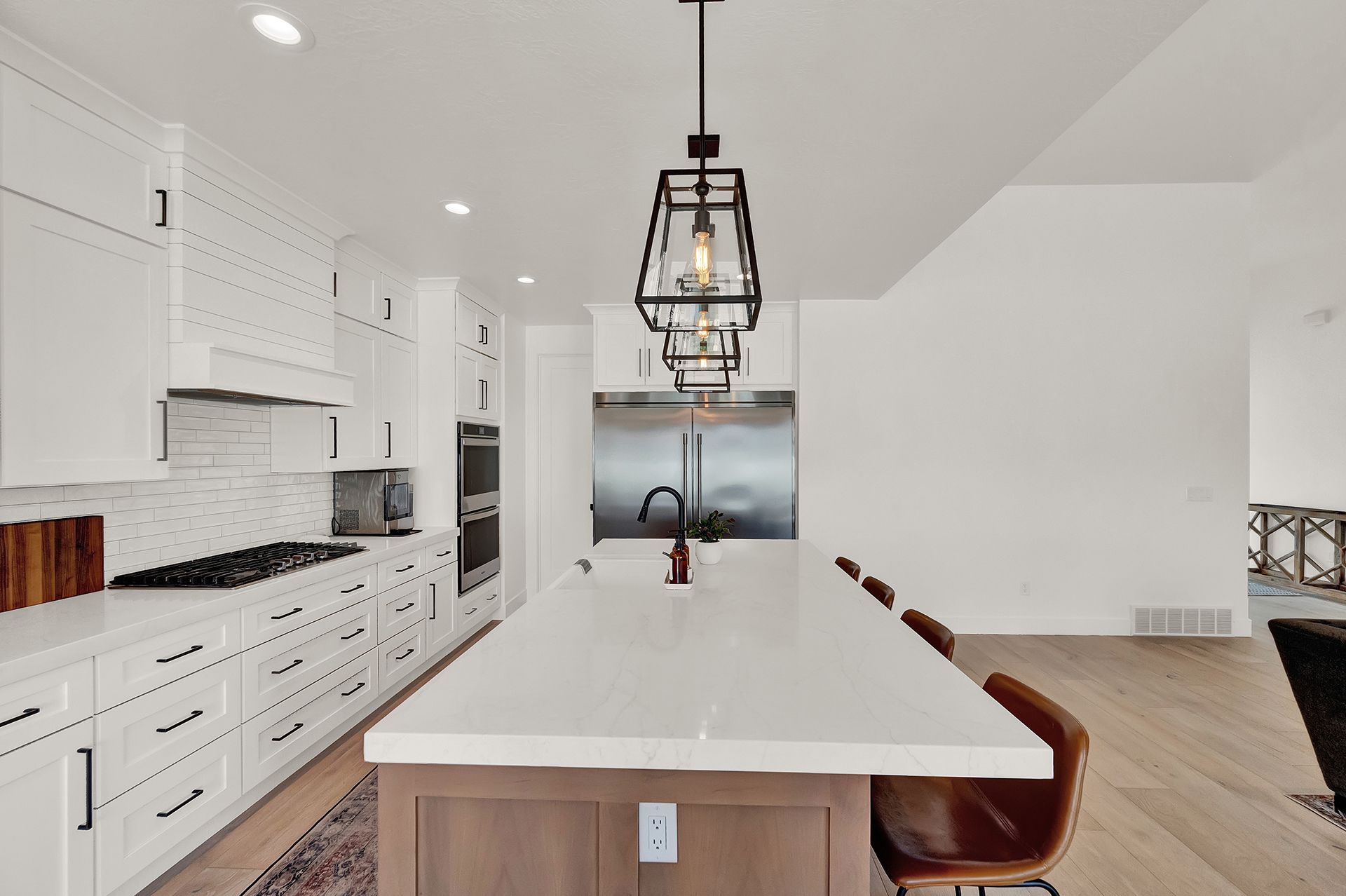 There is a large island in the middle of the kitchen.