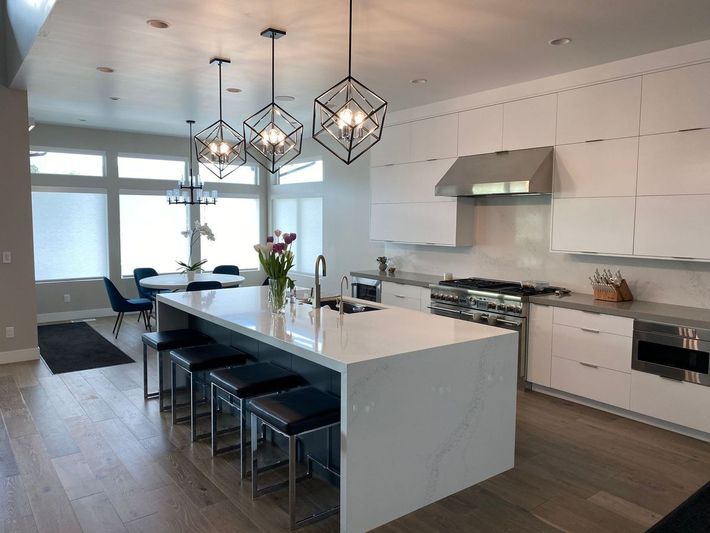 There is a large island in the middle of the kitchen.