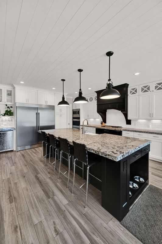 There is a large island in the middle of the kitchen.