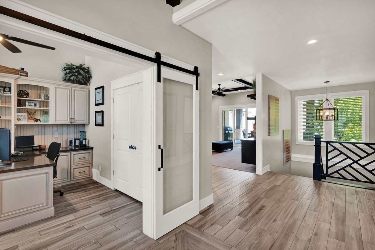 There is a sliding barn door in the middle of the room.