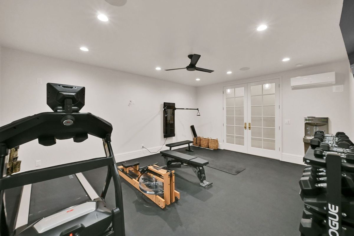There is a treadmill in the middle of the room.