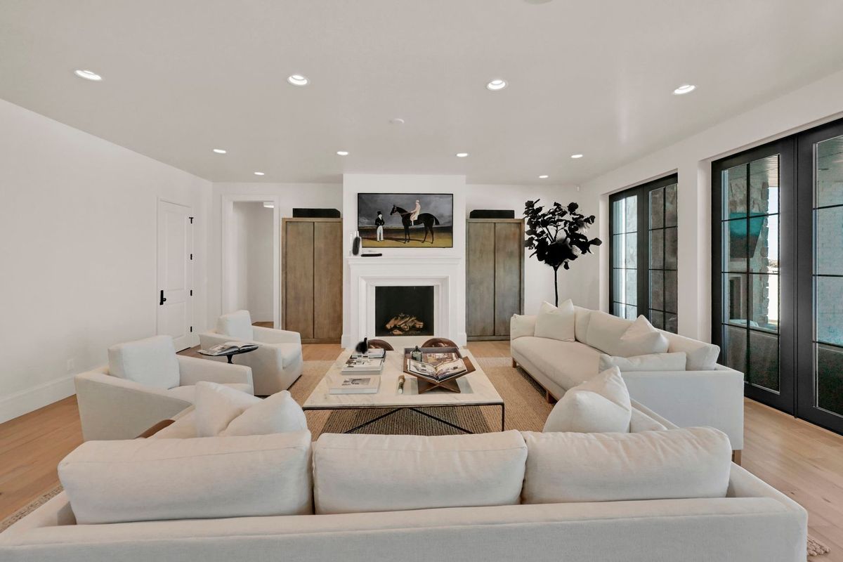 A living room filled with furniture and a fireplace.