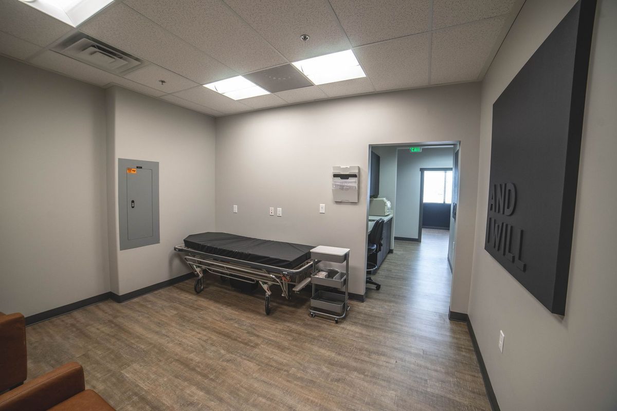 There is a table in the middle of the room.