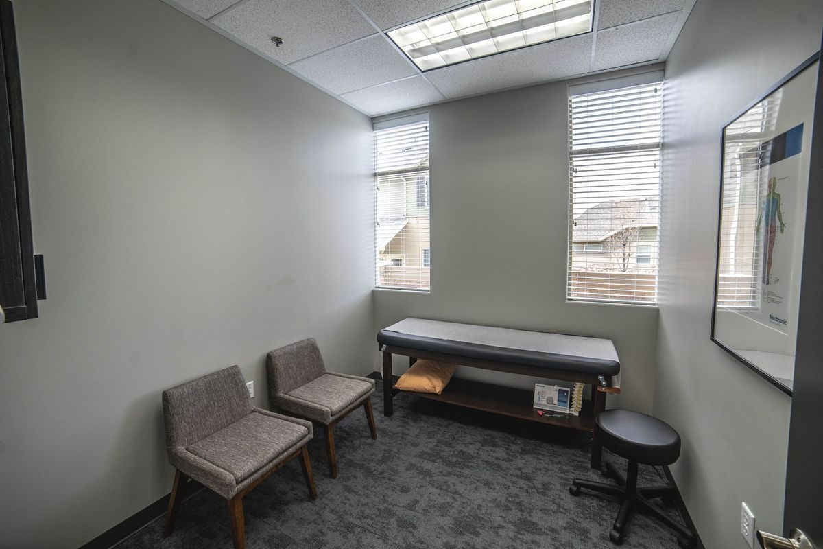 A small room with a table and chairs in it.