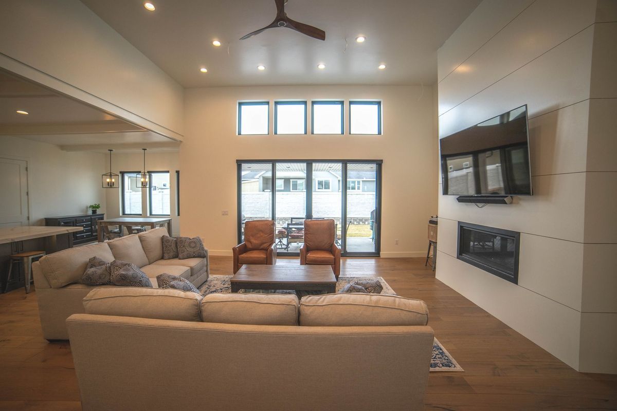 A living room filled with furniture and a fireplace.