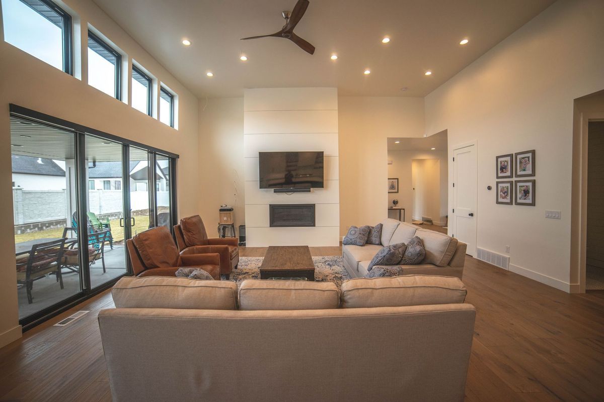 A living room filled with furniture and a flat screen tv.