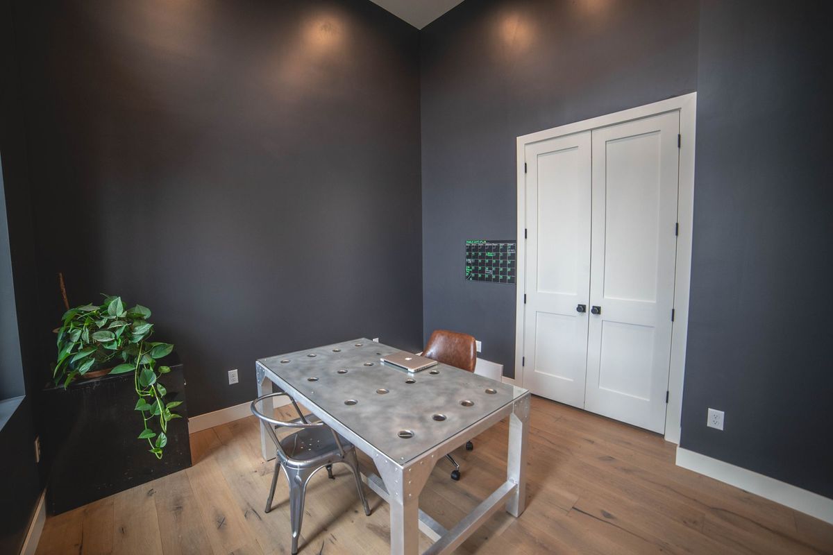 There is a table and chairs in the room.