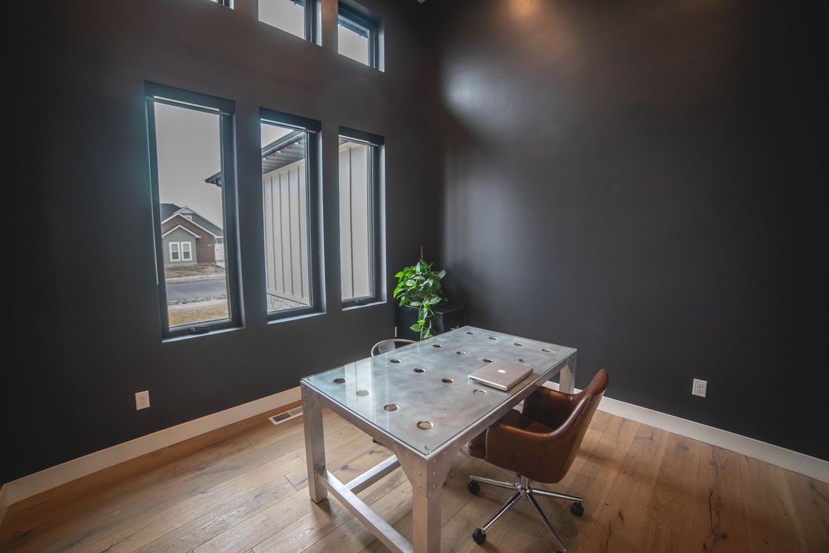 There is a desk and chair in the room.