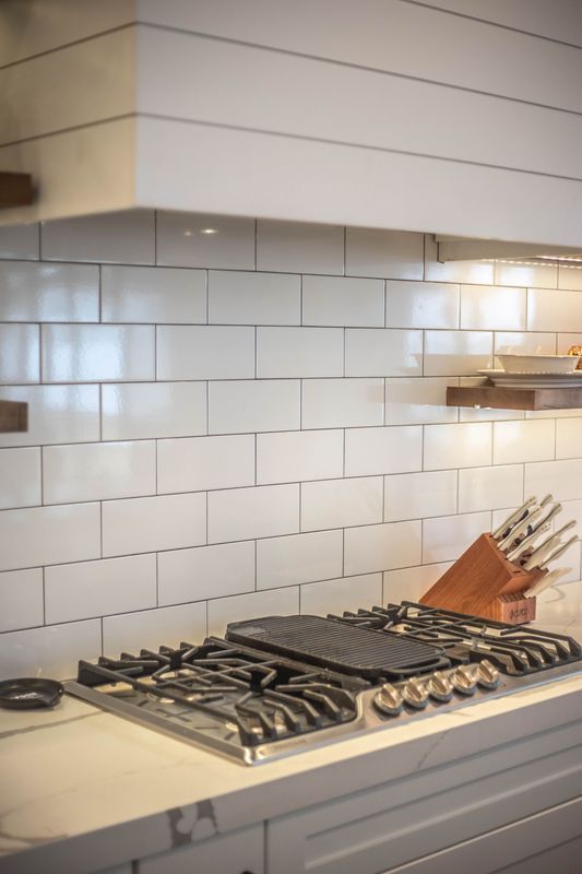 A stove top oven is sitting on top of a counter in a kitchen.
