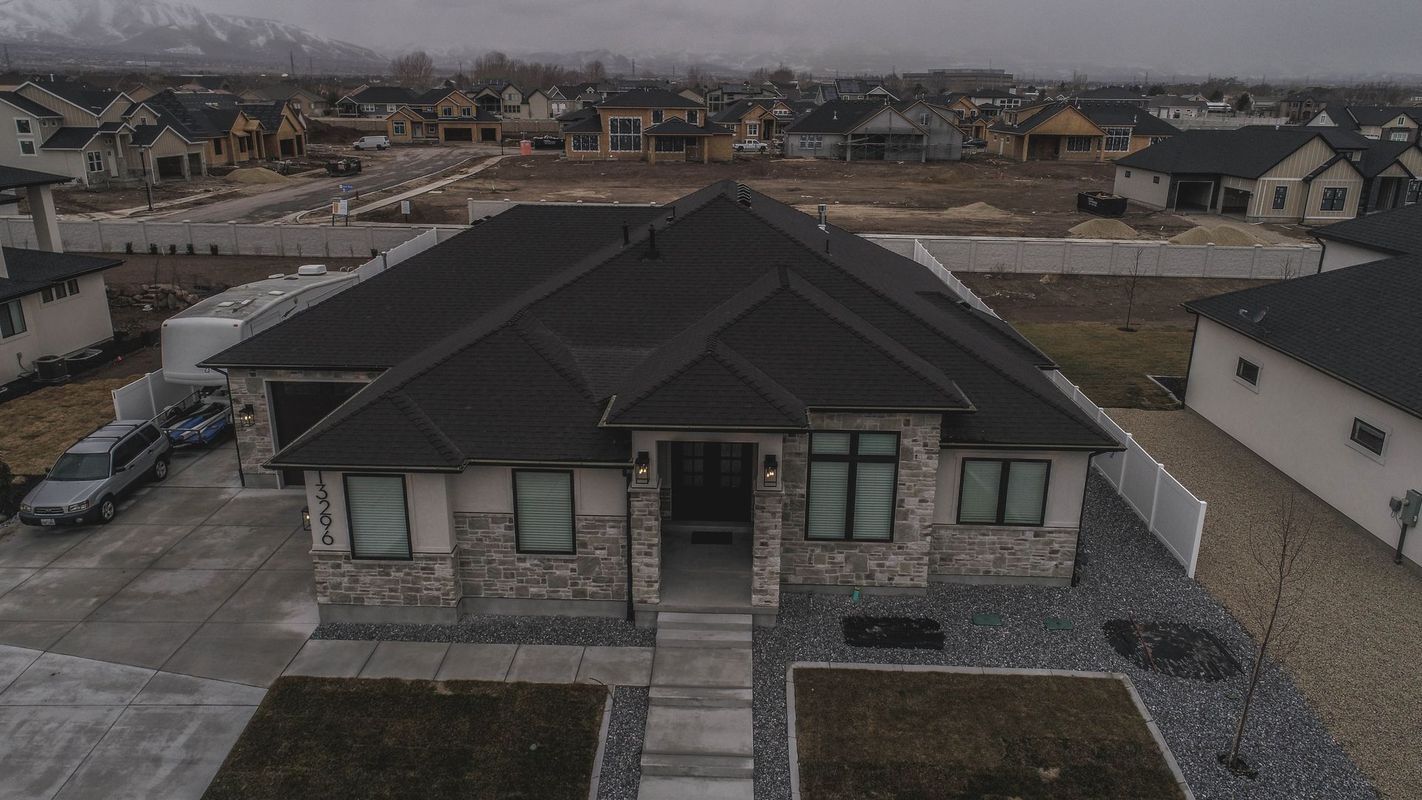 An aerial view of a house in a residential area.