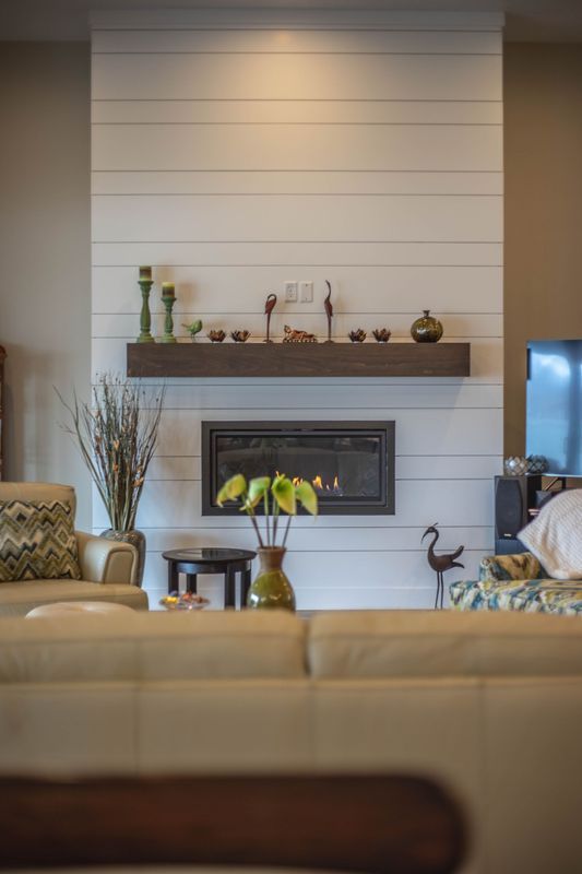 A living room with a fireplace and a couch.