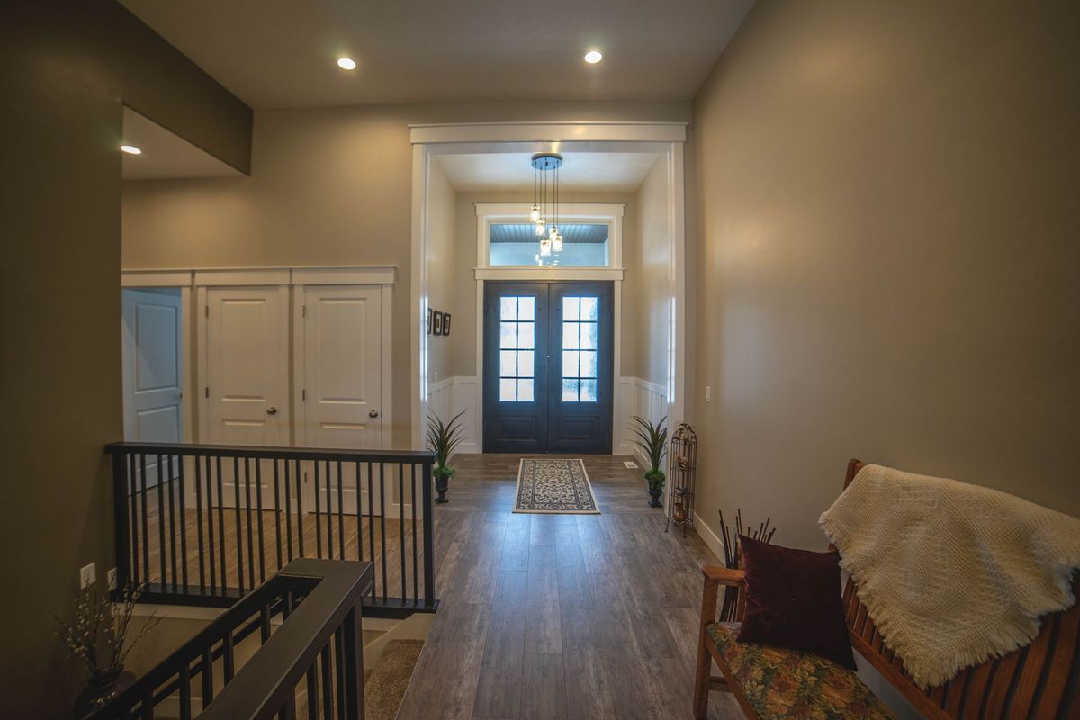 There is a bench in the middle of the hallway.