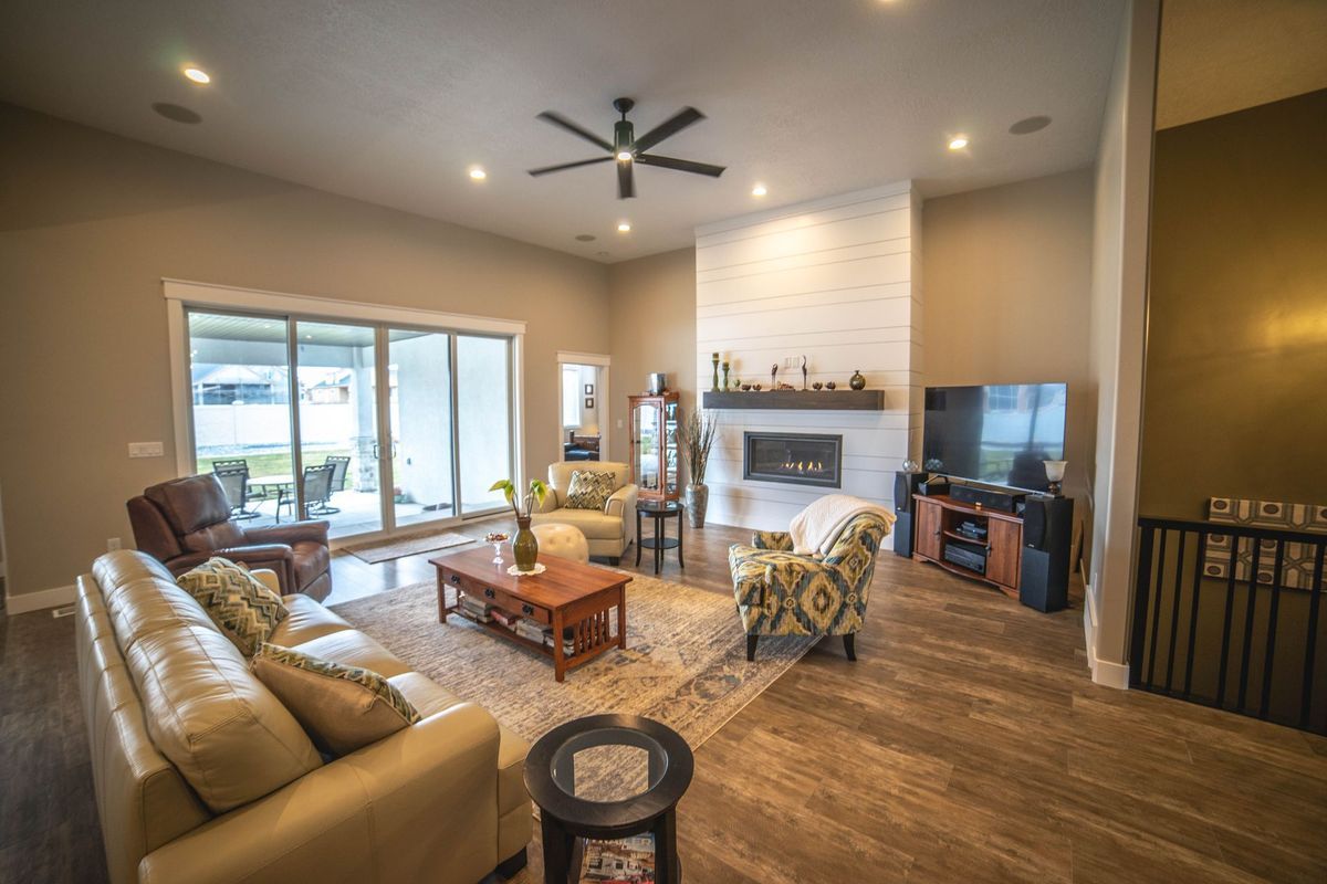 A living room filled with furniture and a fireplace.