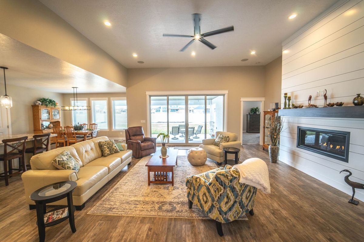 A living room filled with furniture and a fireplace.