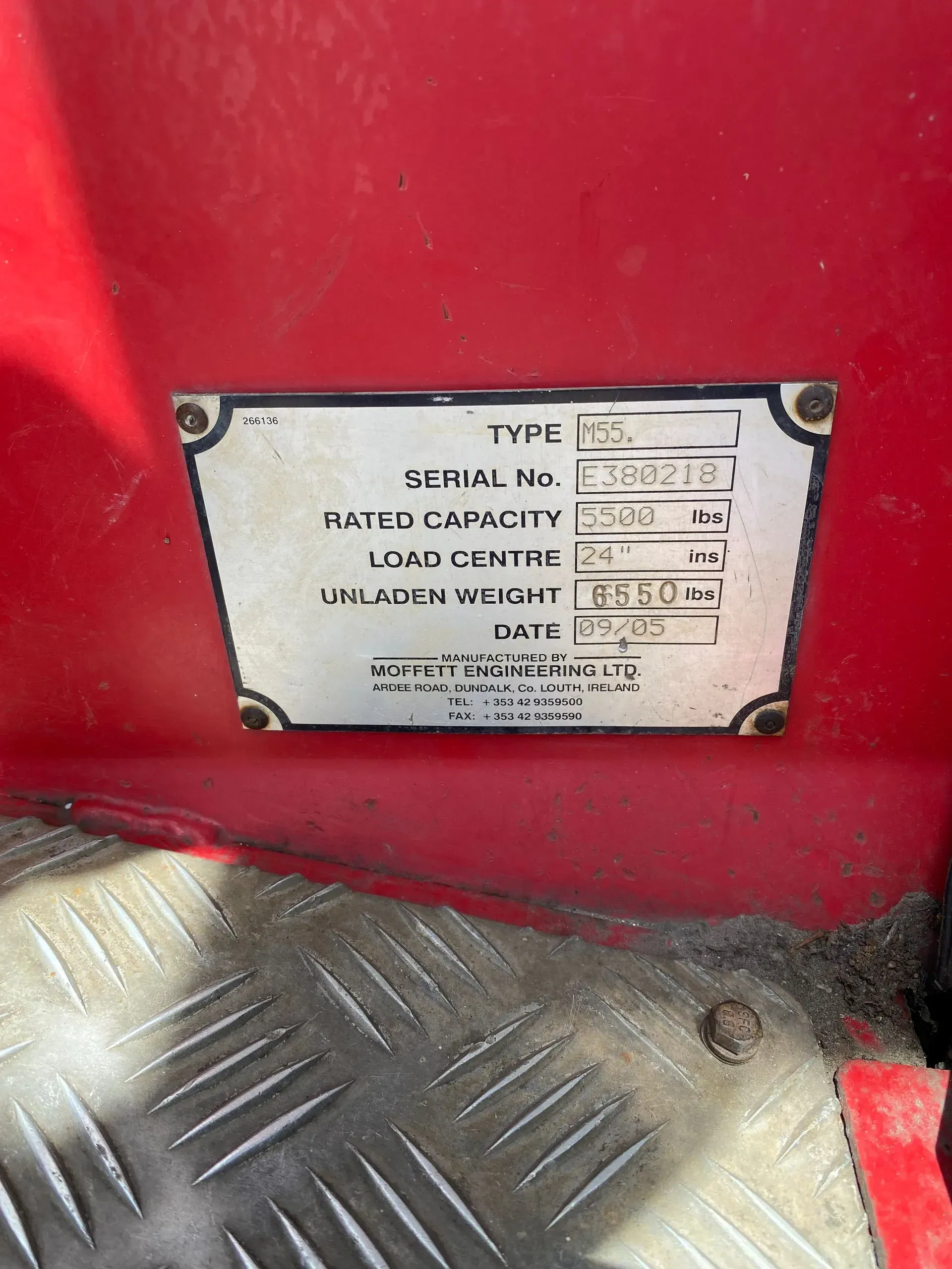 Metal plate on red surface