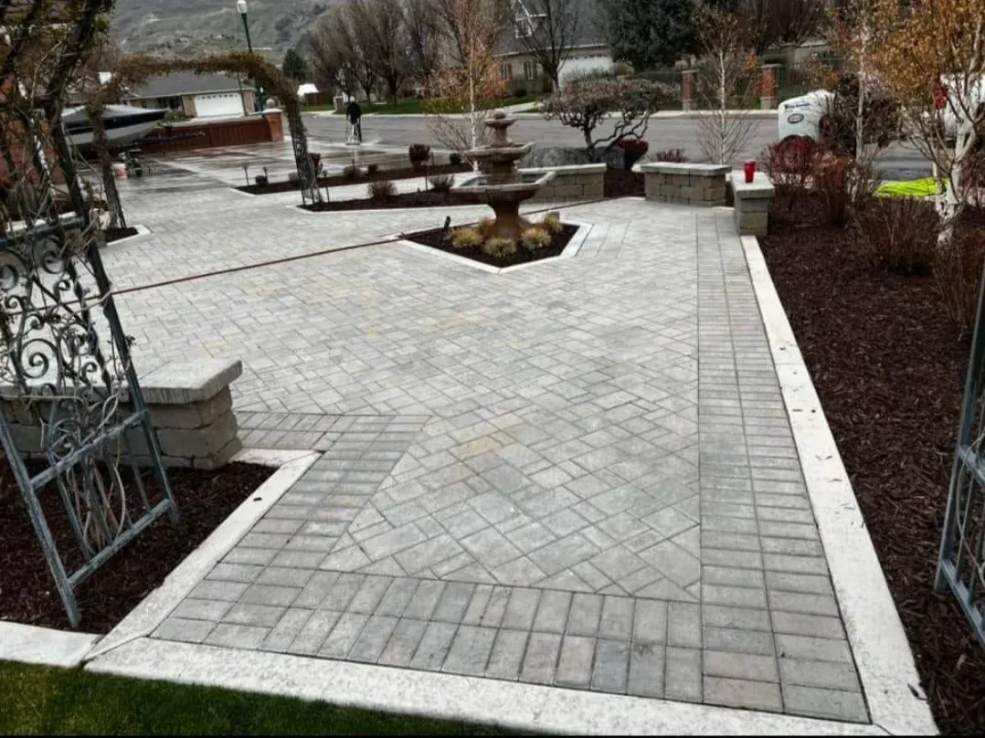 There is a fountain in the middle of the patio.