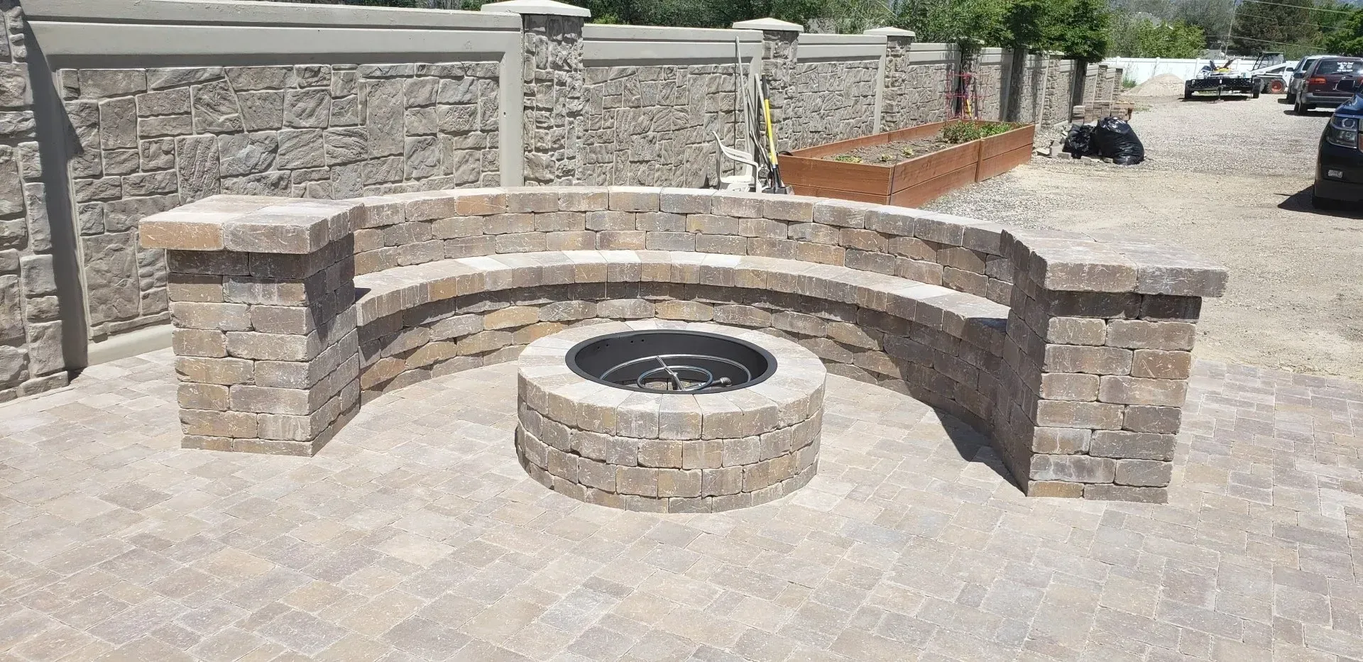 There is a fire pit in the middle of the patio.