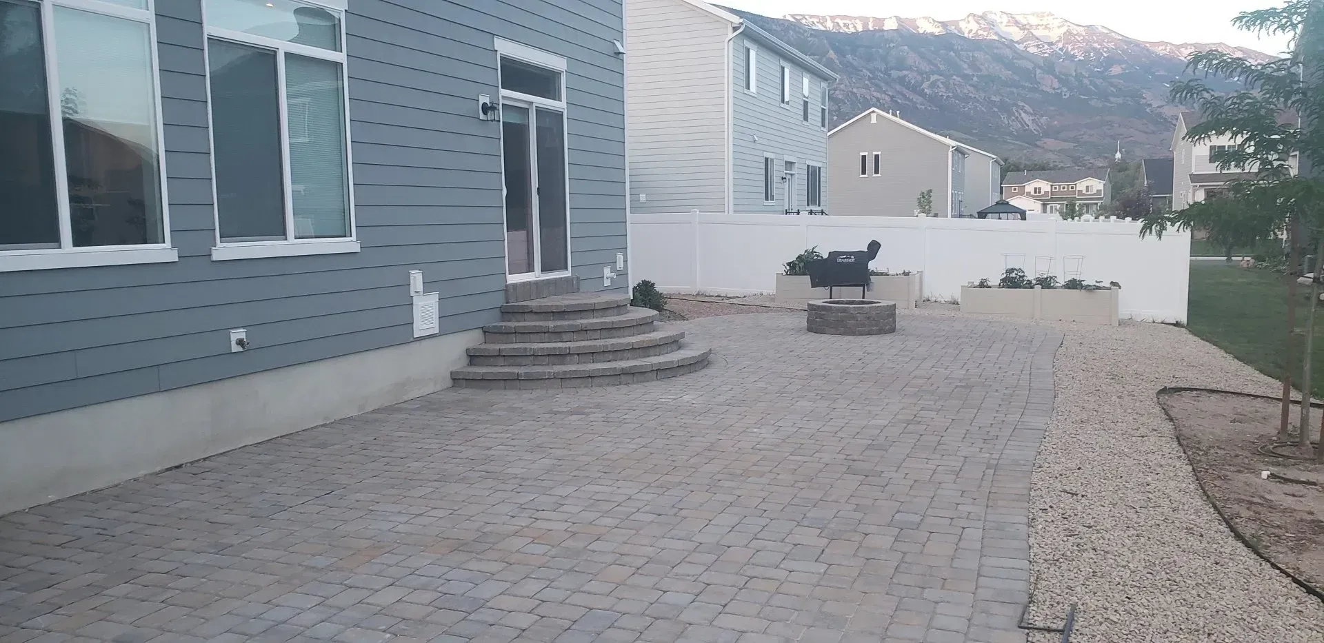 The backyard of a house with a patio and stairs.