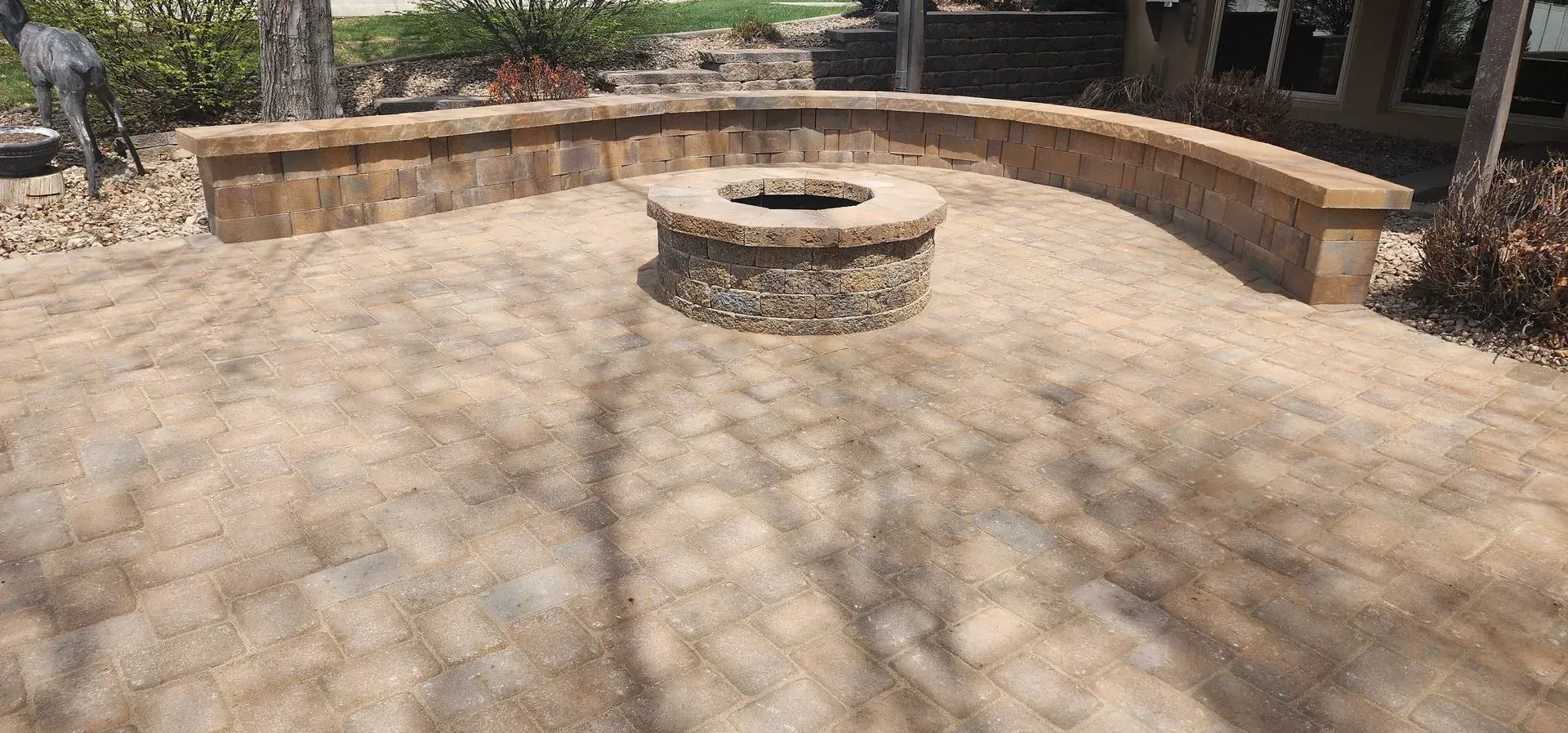 There is a fire pit in the middle of the patio.