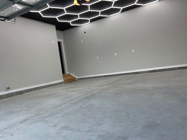 an empty room with a honeycomb pattern on the ceiling