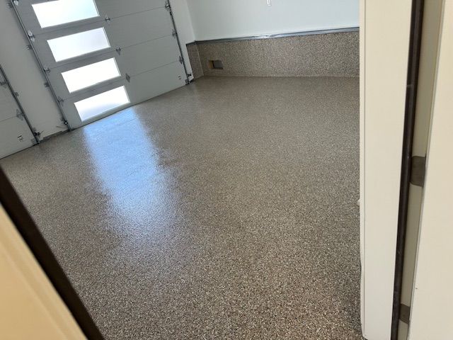 A garage with a shiny floor and a garage door