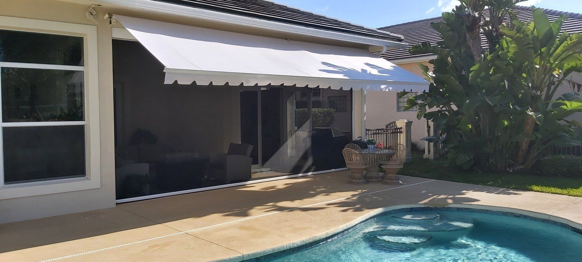 swimming pool with white awning