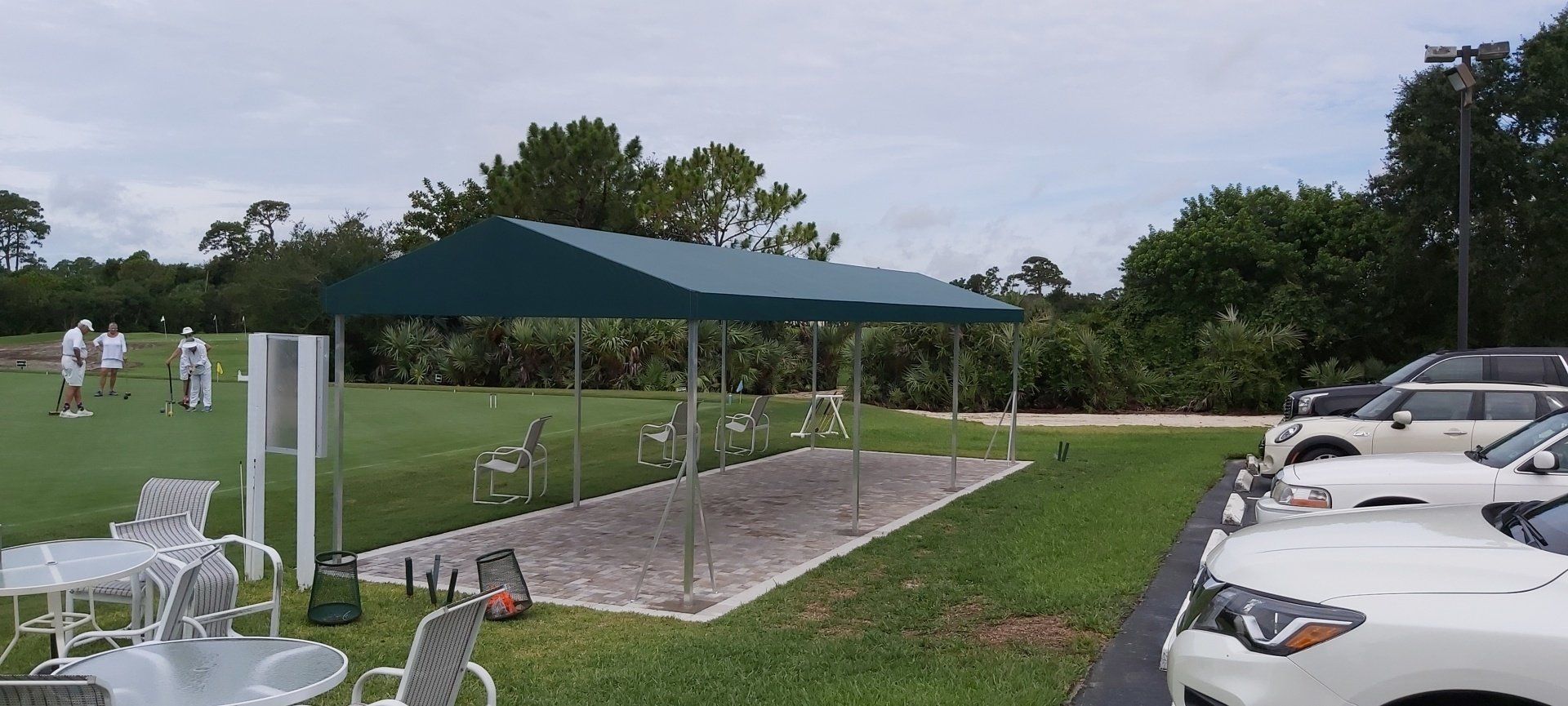 green tent behind cars