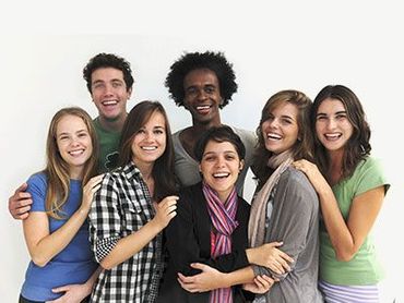 A group of young people are posing for a picture together