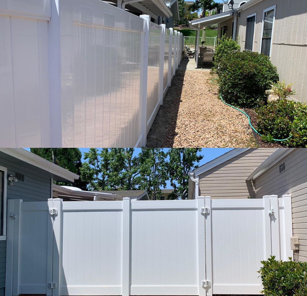 A picture of a white fence next to a house