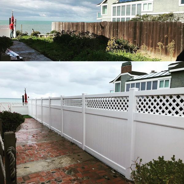 A white lattice fence with a house in the background