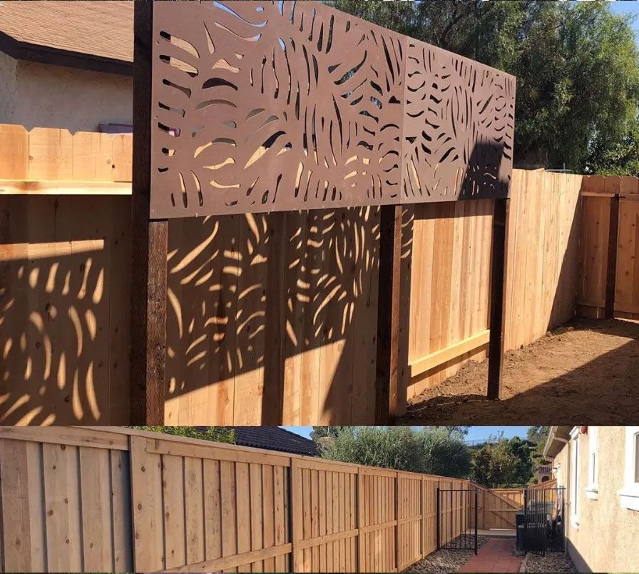 A wooden fence with a design on it
