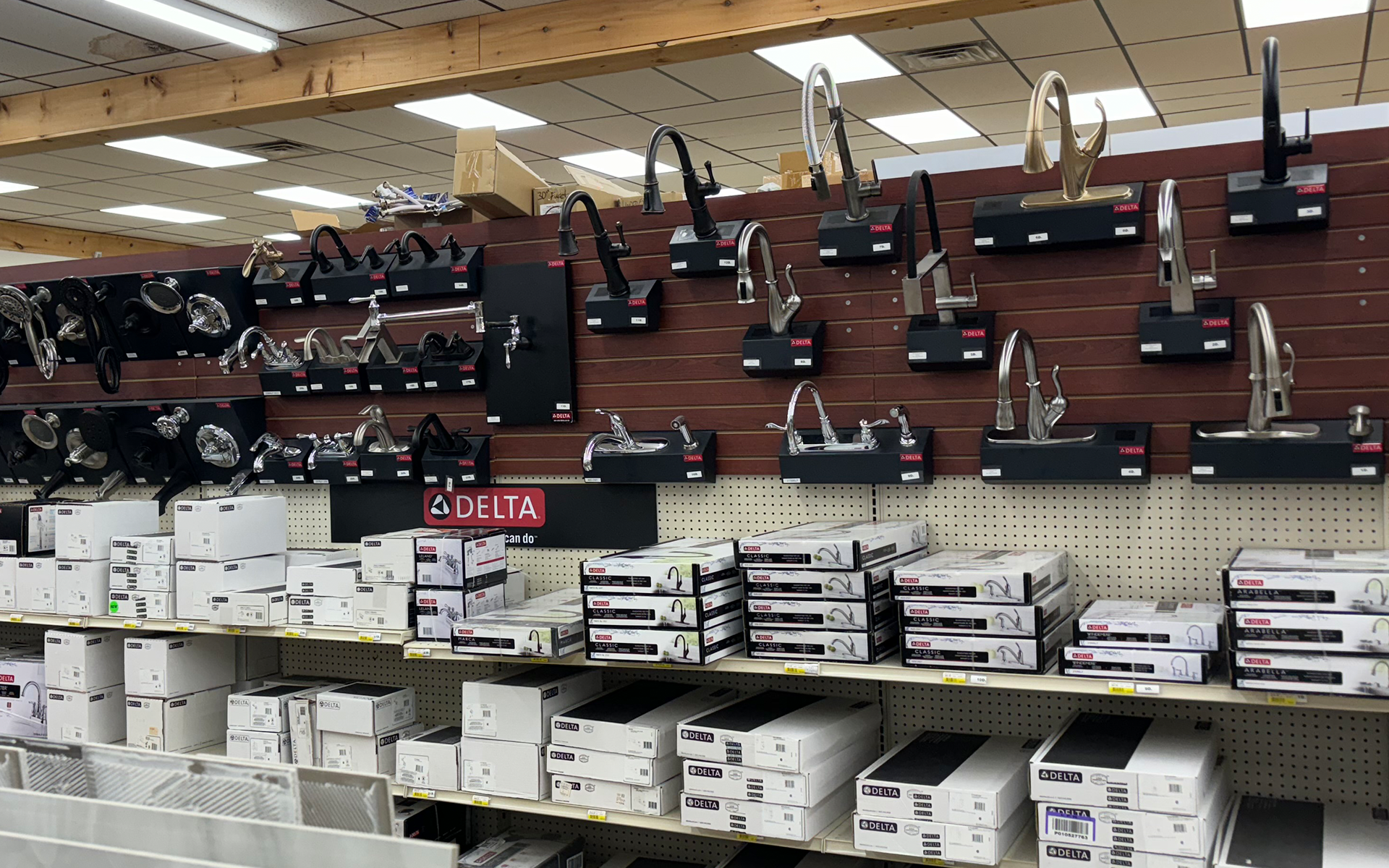 a store filled with lots of faucets and boxes .